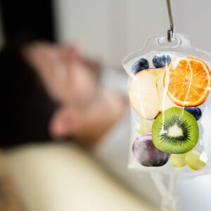 Man laying down and receiving IV therapy. 