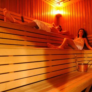 man and woman in infrared sauna