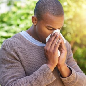 man suffering from allergies