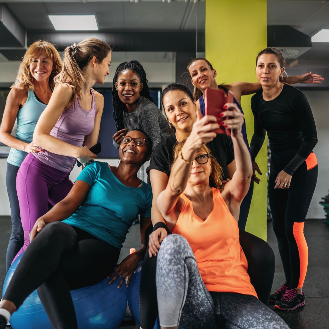 group of ladies taking a picture at the gym